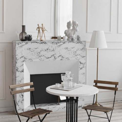 white-living-room-interior-of-retro-table-two-chairs-and-marble-fireplace-min